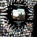 An image of a woman looking at a digital art exhibit.