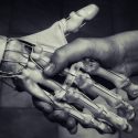 Image of a robot and human shaking hands